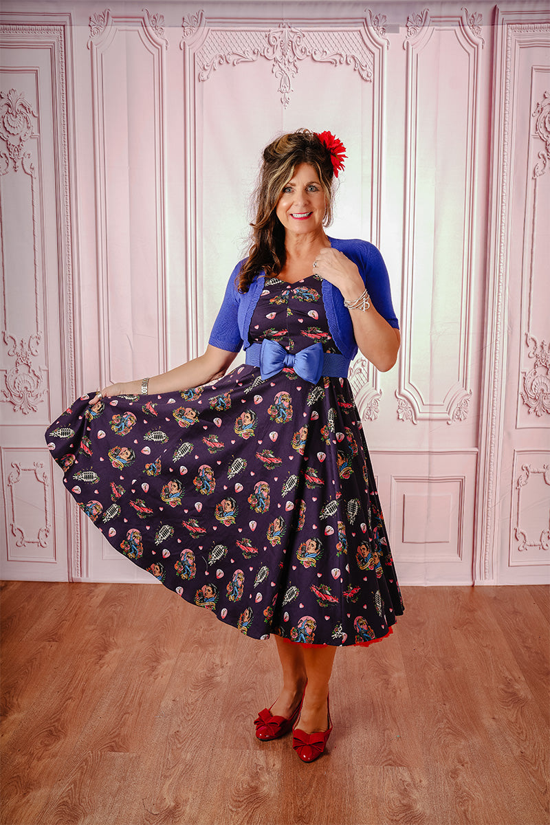 All Shook Up Swing Dress Paired with a blue cardigan on Model