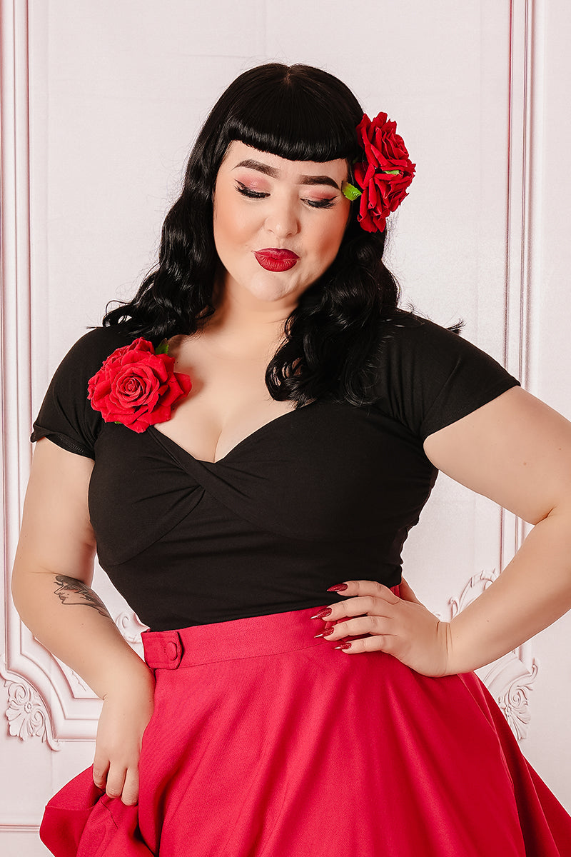 Black Tammy Twisted Top on Model Paired with Red Skirt