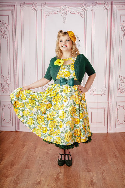 Dawny Swing Dress on Model paired with Yellow Fascinator and Green Bolero