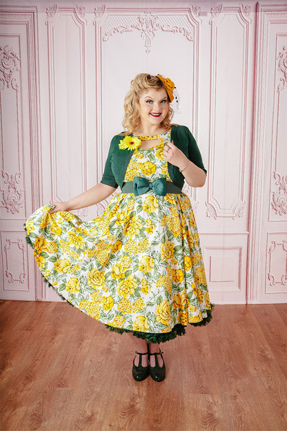 Dawny Swing Dress on Model paired with Yellow Fascinator and Green Bolero from Front